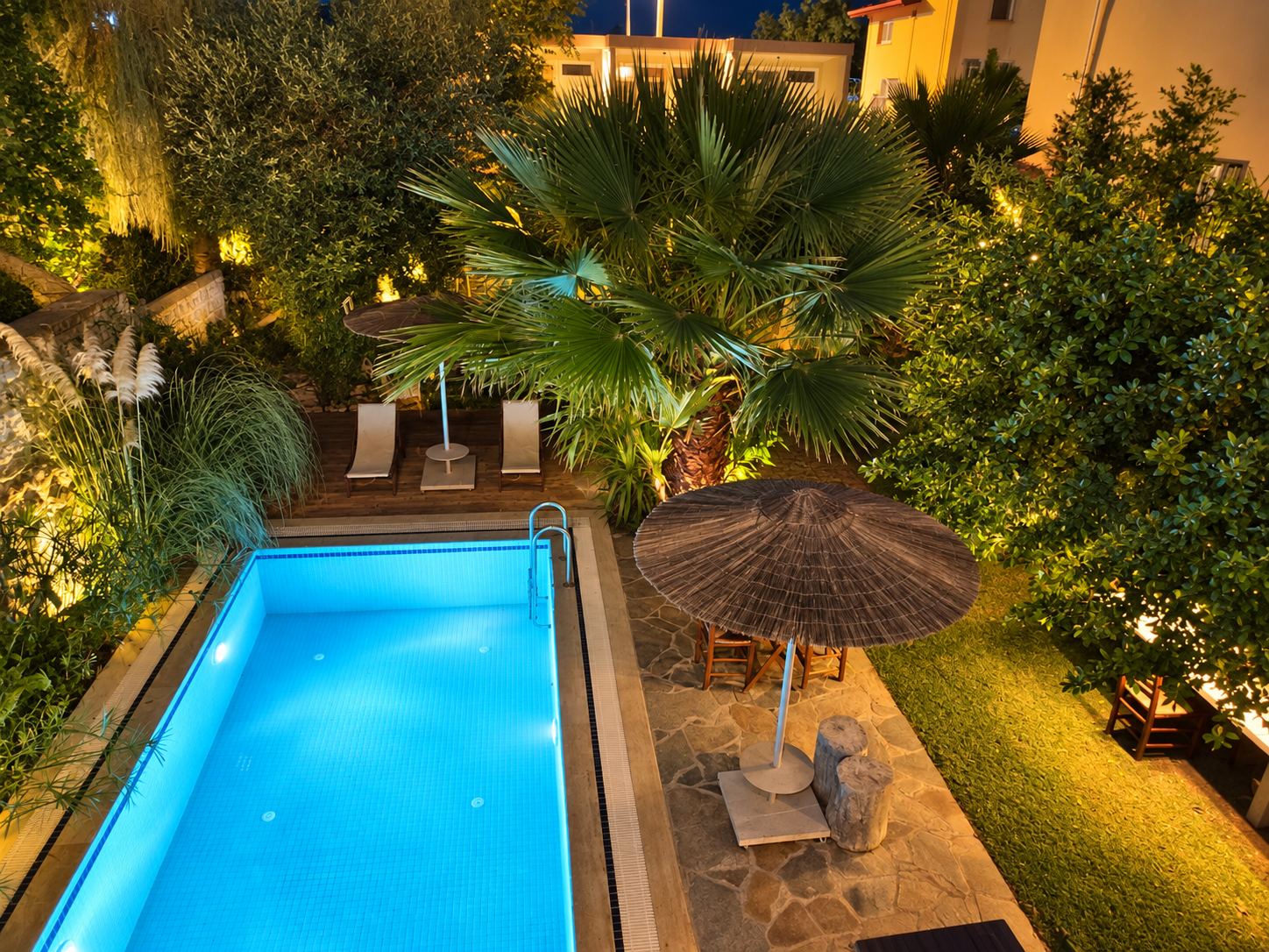 The pool and garden at night